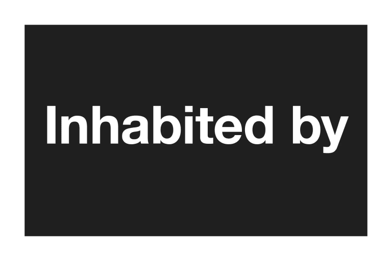 A black rectangle with white type that says, "Inhabited by."