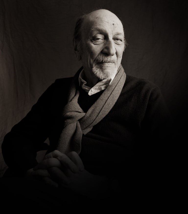 A black-and-white photograph of Milton Glaser.