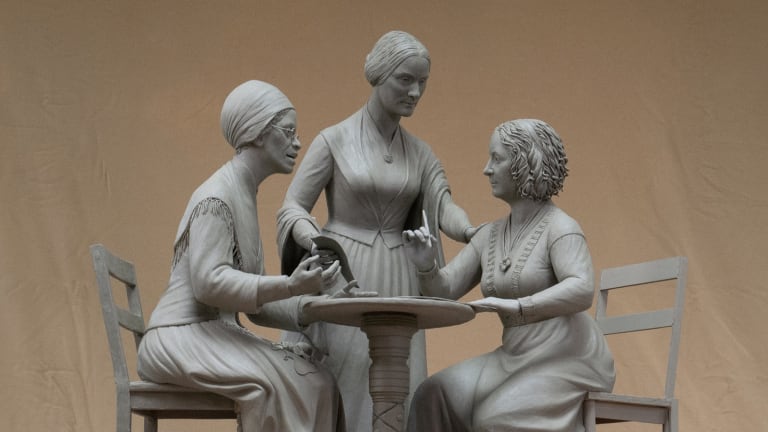 Here is a photo of the Women’s Rights Pioneers monument, depicting three suffragists debating around a table. 