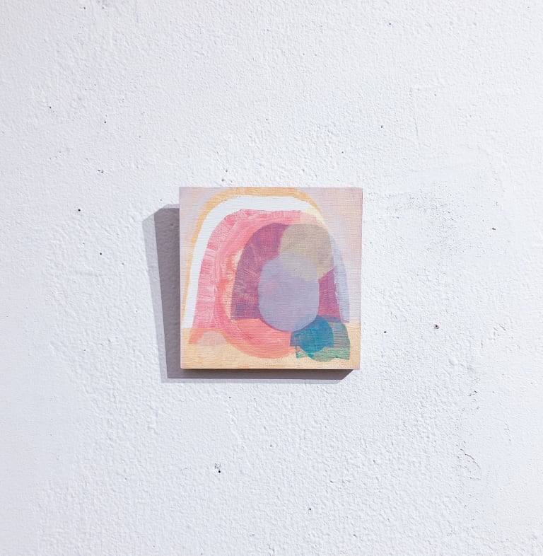 A four-inch-square painting in acrylic on panel of several superimposed forms in different colors, all of which are shaped like an irregular, roughly semicircular form superimposed over an oval central shape.