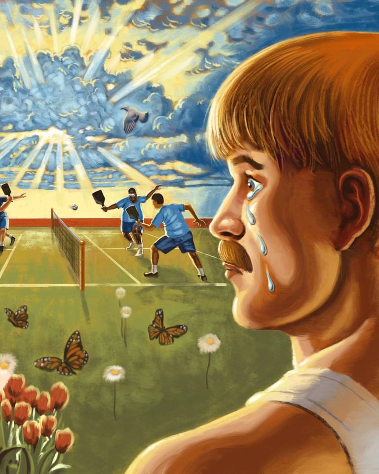 A man with tears running down his cheek staring at a pickleball court, watching four players in blue play a match.