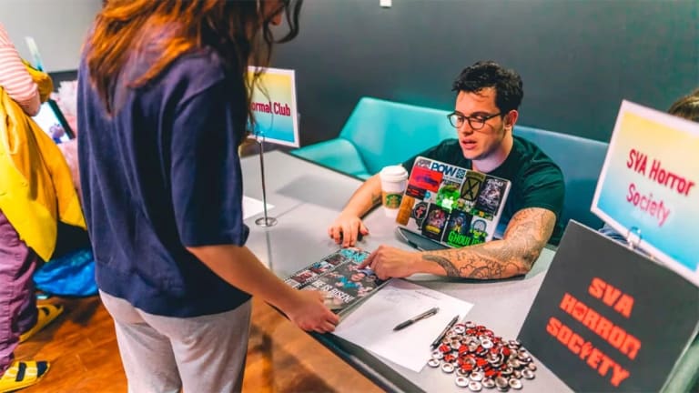 A photograph of the SVA Horror Club table at a the SVA Club fair.