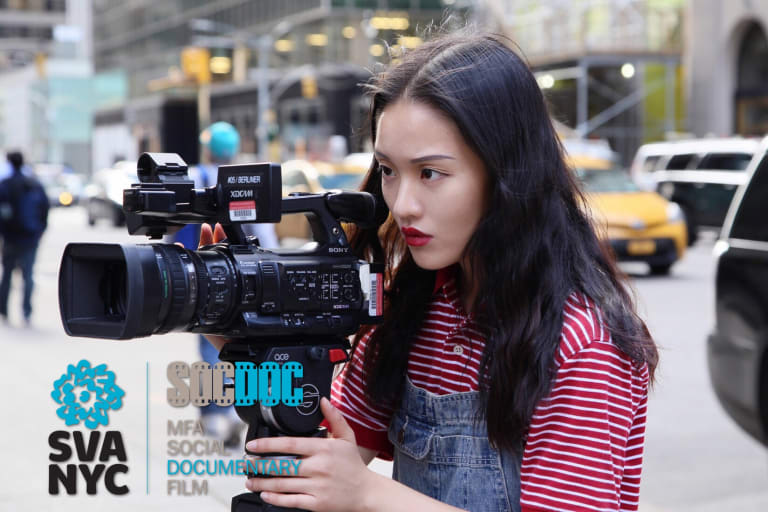 A girl looks intently into a video camera, filming something out of sight, on a city street. "SVA NYC MFA Social Documentary Film" is printed on the image