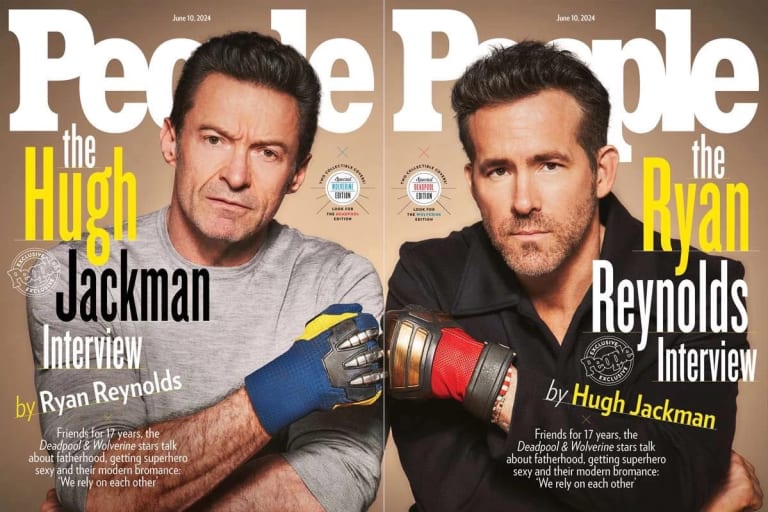 Two men, one in a gray shirt on the left, the one on the right in black, fist bump each other wearing colorful gloves while staring at the camera on the cover of 'People' magazine. 