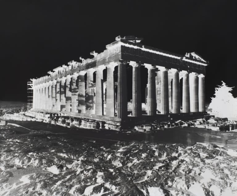 Black-and-white inverted image of the Acropolis building remains in Athens, Greece. 