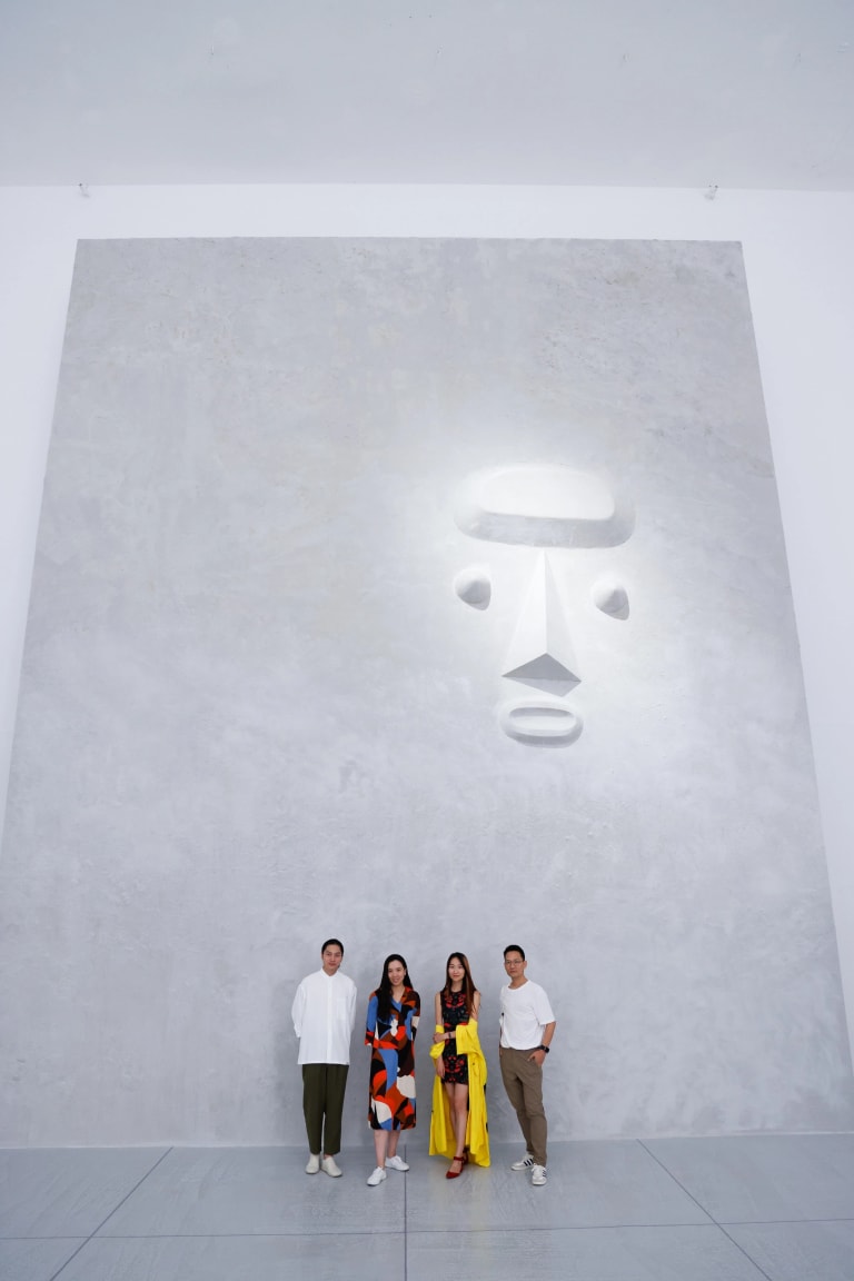 Image of four people standing in front of the reenacted Noguchi 1947 monument for a post-atomic humanity for the exhibition "To Your Eternity". Xin Wang stands from the left. 