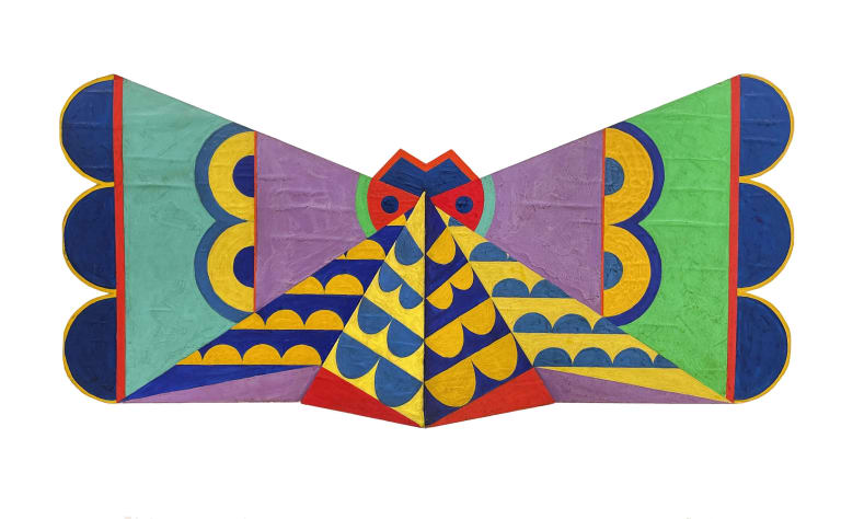 A cut-out canvas that vaguely looks like a butterfly, with bright, abstract geometric shapes