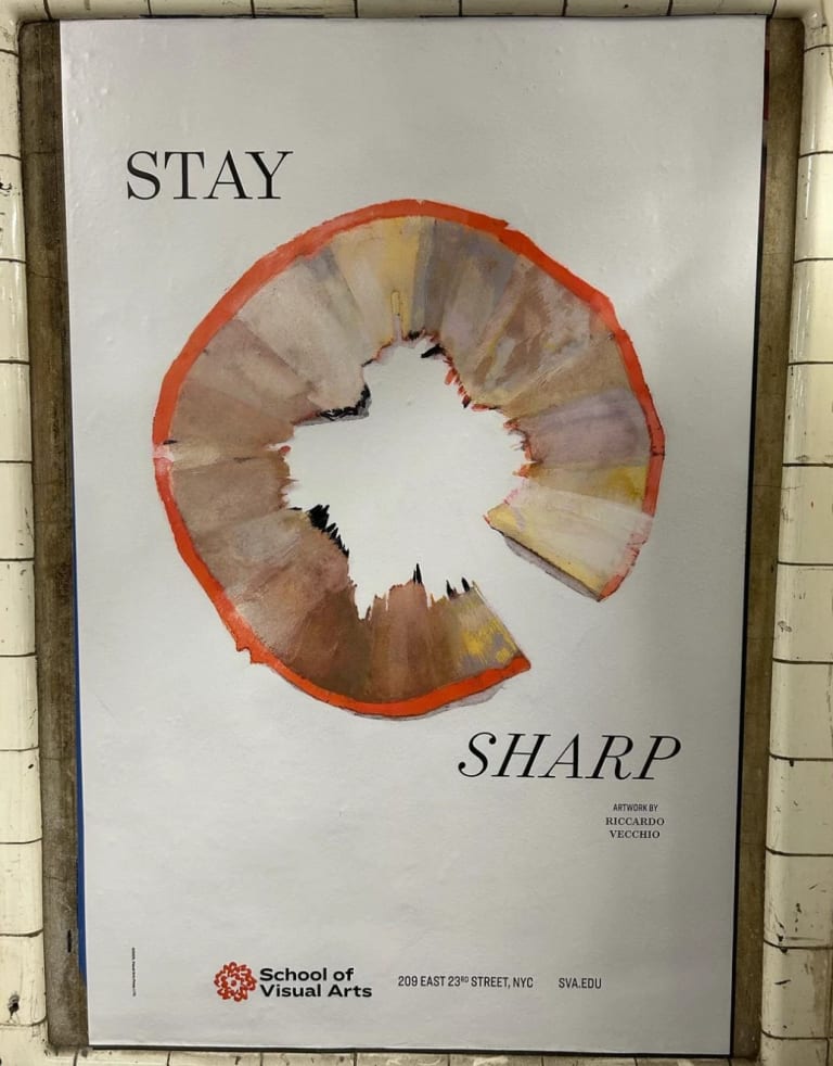 A poster in the new york city subway that features a pencil shaving curled in a circle and the text "stay sharp"