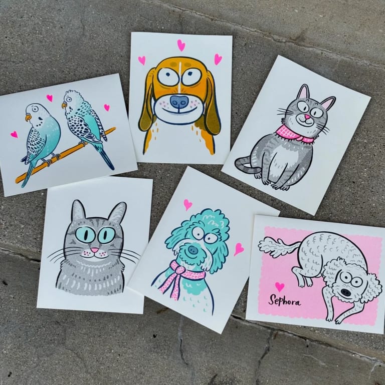 six drawings of pets scattered on concrete