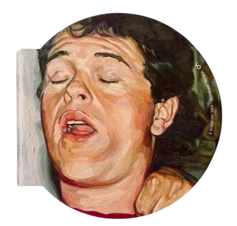 A disc shaped book with a painting of a man on the cover