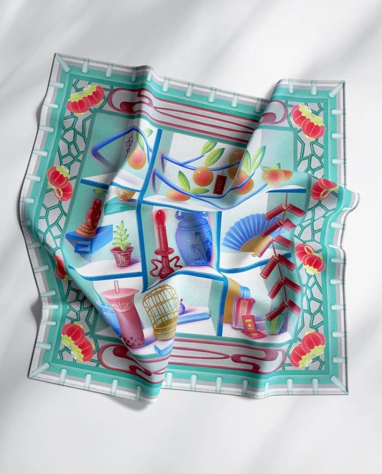 Image of a silk scarf with a series of still life illustrations printed on it 