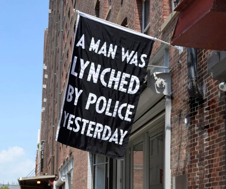 A banner demonstrating against police abuse