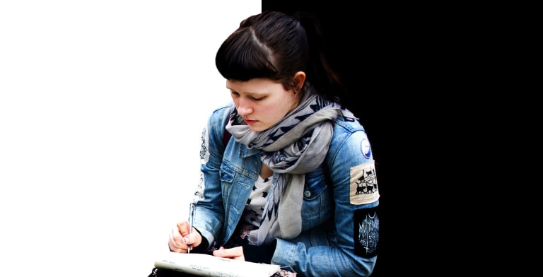 A girl sitting and writting