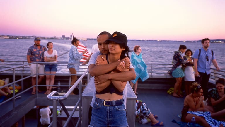 A photograph of a couple hugging one another on a boat.<span class="redactor-invisible-space"> </span>
