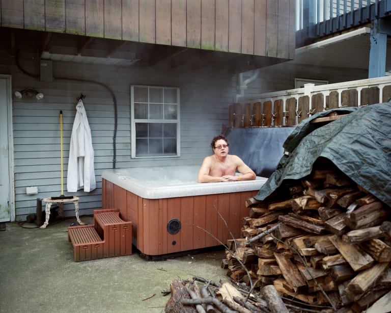 A picture of a guy inside a jacuzzi
