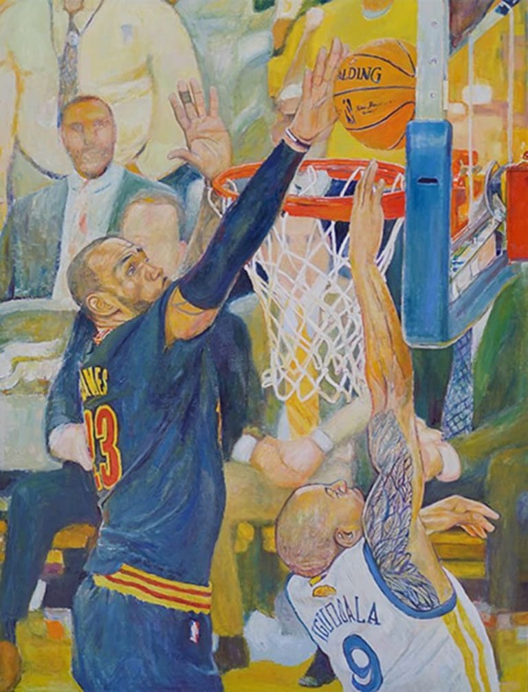 Two men playing basketball: one dunking and one attempting to block while a crowd looks on.