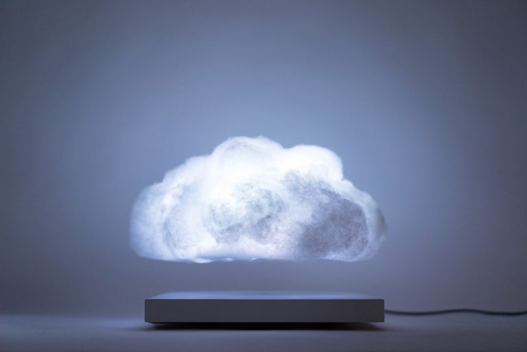 a raincloud above a gray square which floats over a white floor