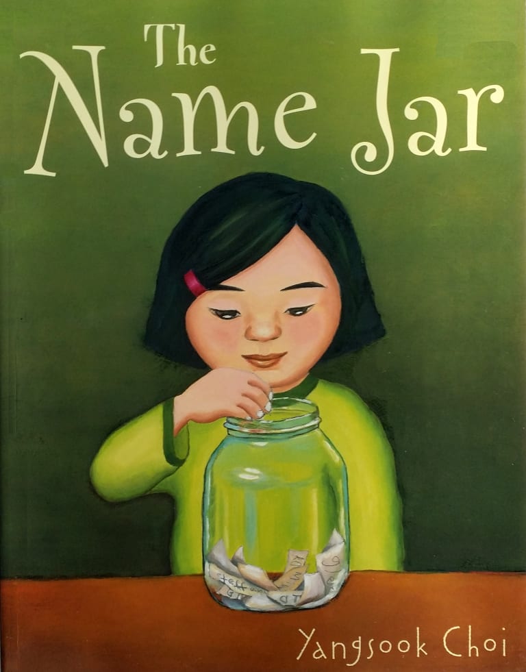 <p "="">An illustrated book cover showing a child with her hand over a large glass jar containing many slips of paper.
