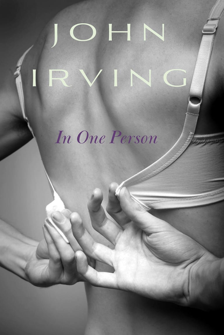 A woman unstrapping her bra with the text "John Irving In One Person"