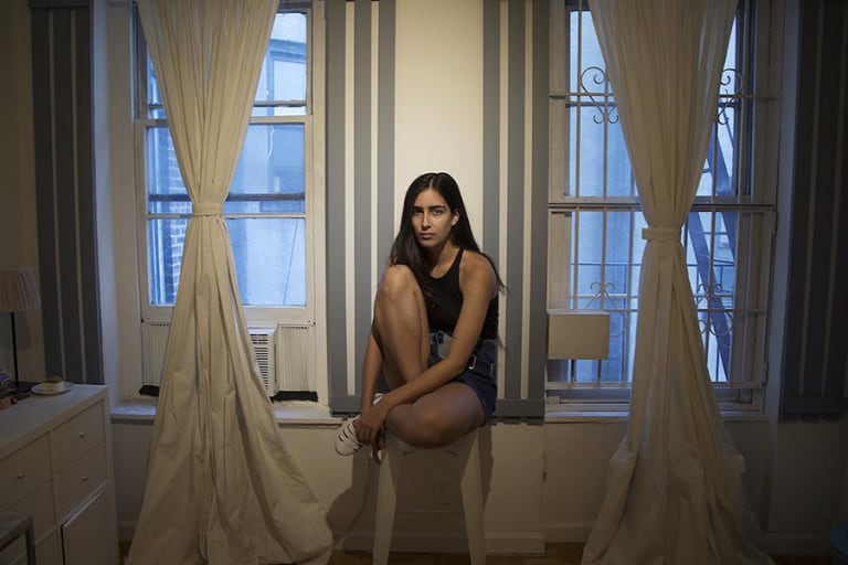 Girl sitting on a windowledge