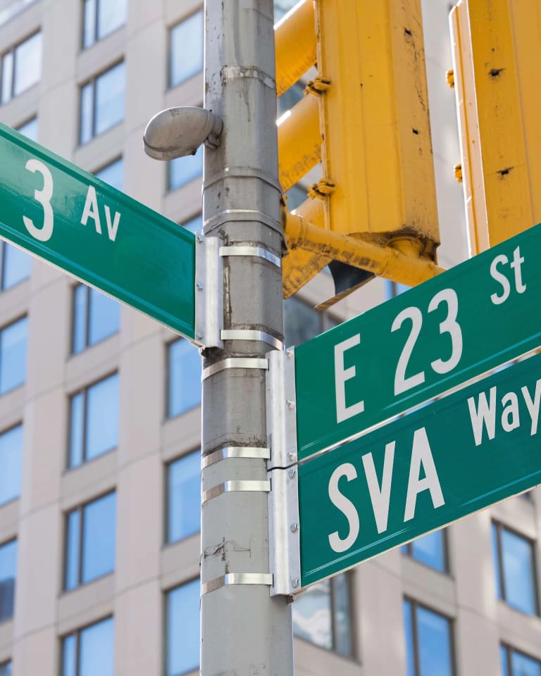 Picture of a green New York street sign, at the intersection of 3rd avenue and east 23rd street. Below the "E 23 st" sign, a new sign reads "SVA Way"