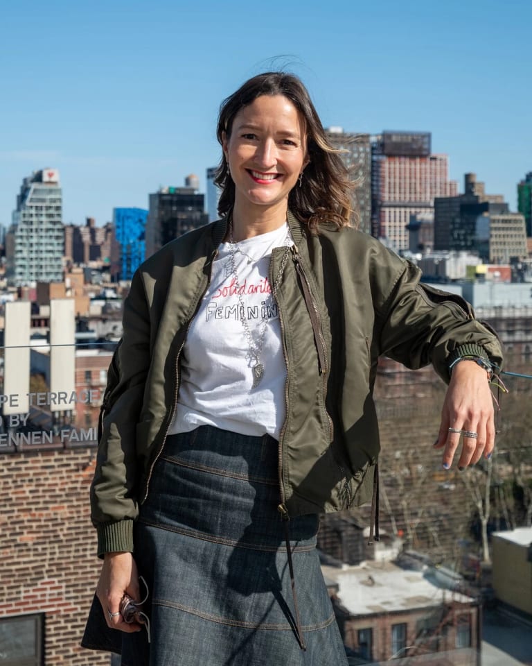 Photograph of the scholar Eva Diaz standing on the roof.