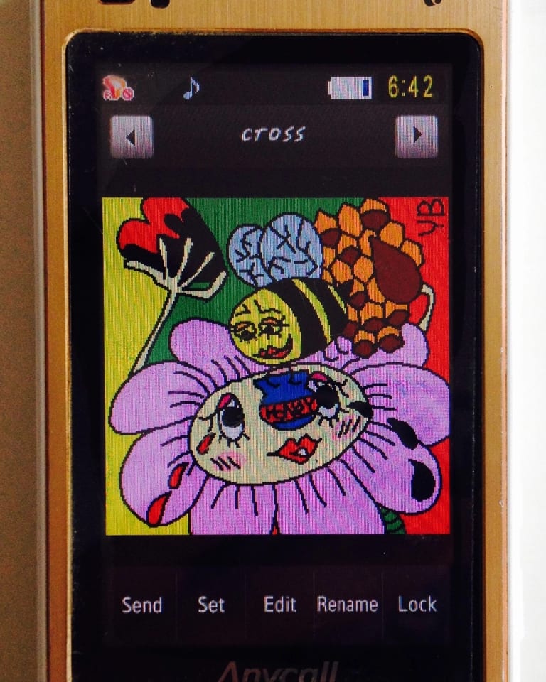 Picture of an old smartphone with a colorful illustration of a bee with a honeypot on top of a flower. Both the flower and the bees have faces and they're looking at each other fondly. 
