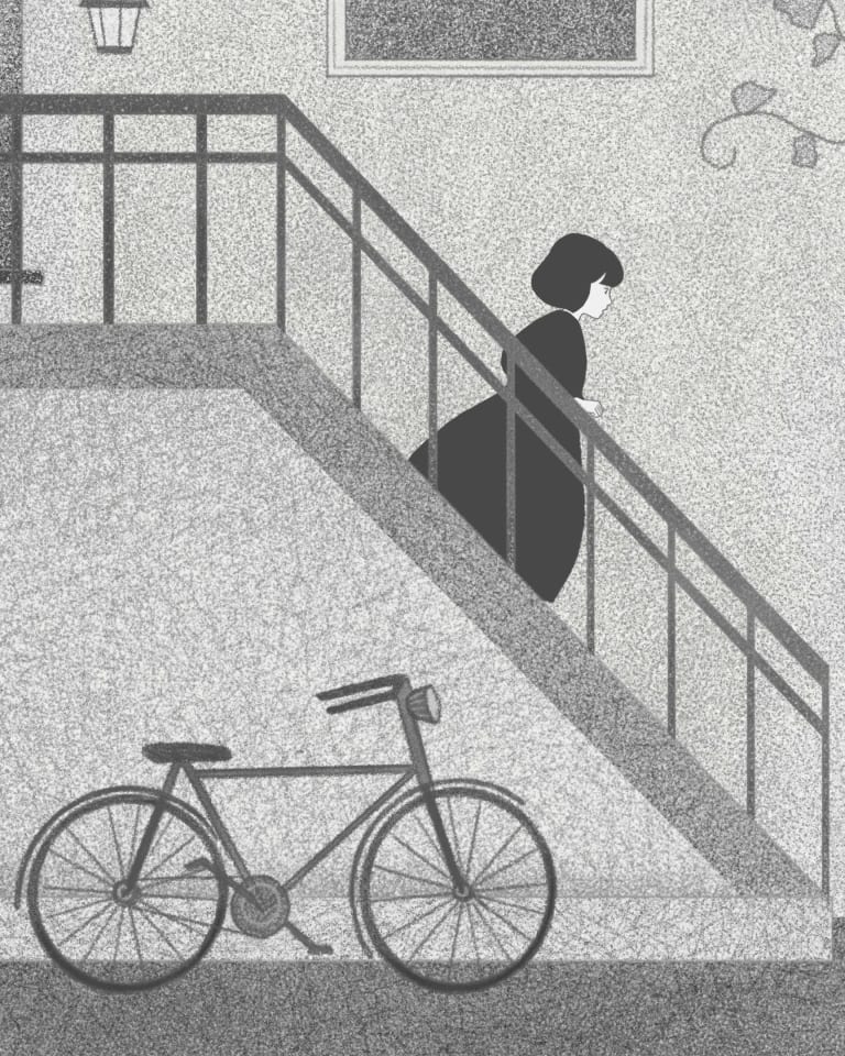 A black and grey street scene of a woman walking an exterior staircase.  There is a black cat in front of her running away. There is a bicycle leaning against the building. 
