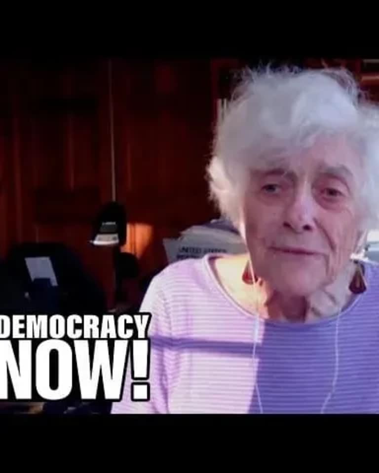 Frances Fox Piven in front of bookshelf, with Democracy Now logo