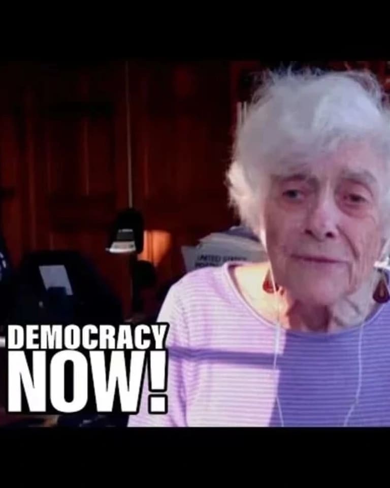 Frances Fox Piven in front of bookshelf, with Democracy Now logo