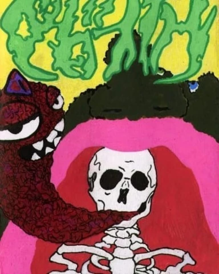 Felt image of a skeleton in a cave with a red worm monster coming out of its mouth.