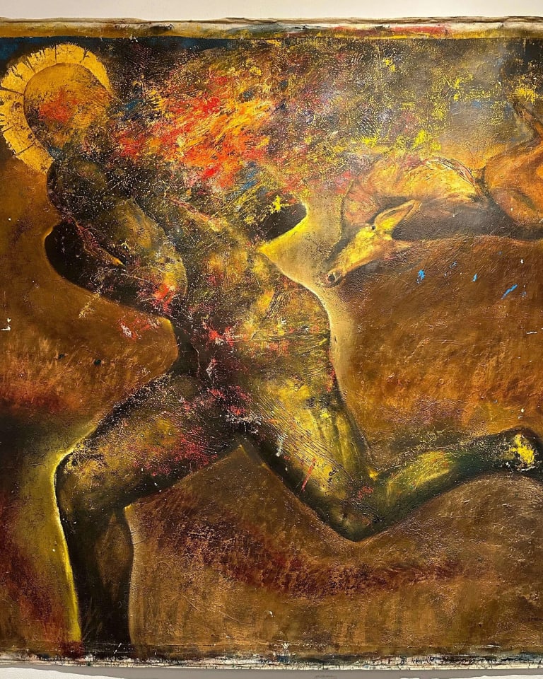 Painting of a human figure in what seems to be a running position. On the background there seems to be a dead animal. The painting is in largely brown and dark yellow tones, and it is covered in textured strokes and paint splatters. 