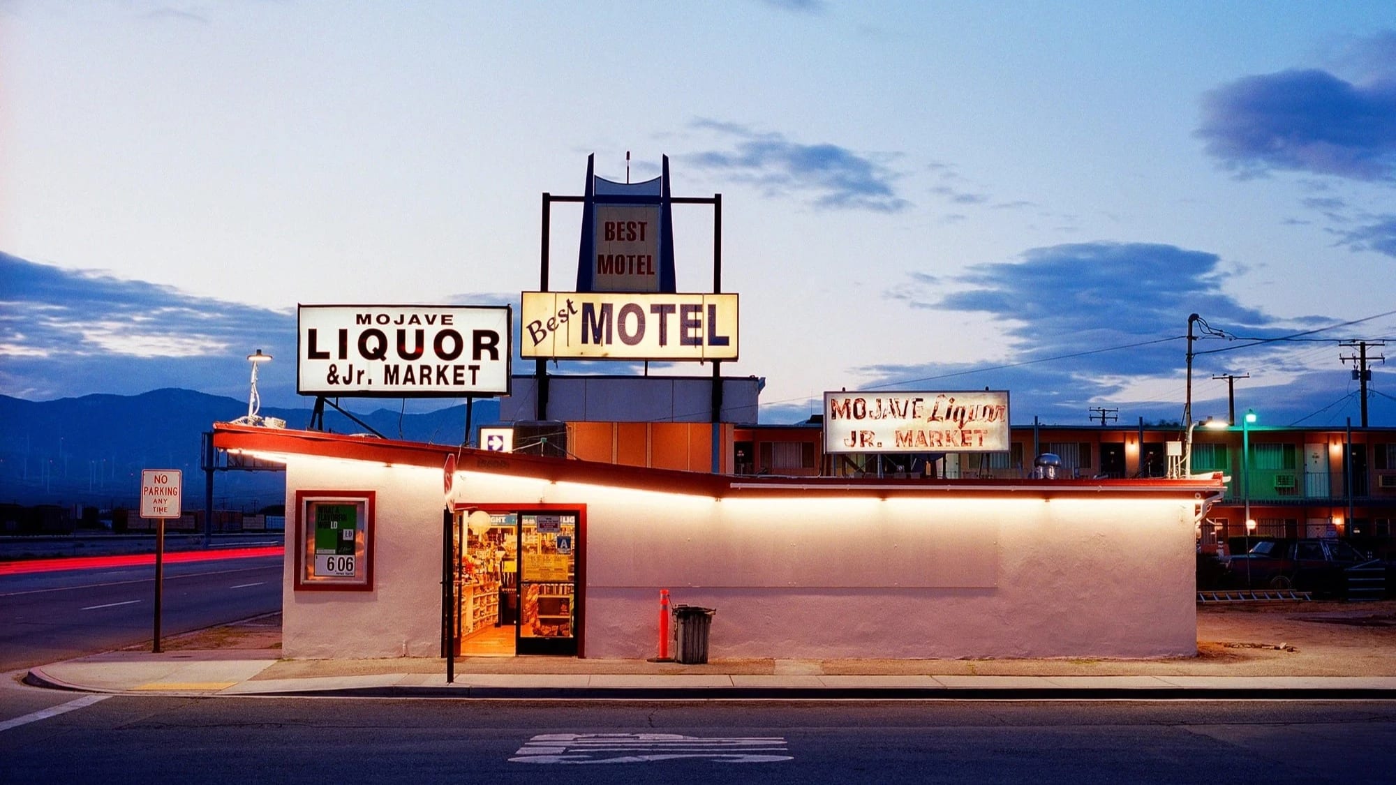 A liquor store photographed as night descends on the small town of Mojave, California