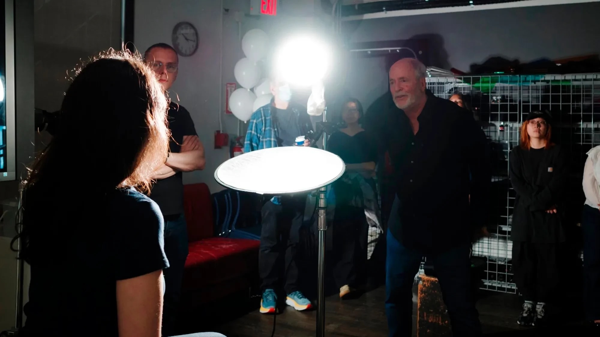 A photo from a lighting workshop with Greg Gorman, where one of our student is modeling for the class to demonstrate lighting techniques.