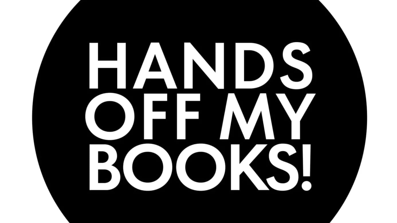 Round black button with text in white that reads "Hands Off My Books!"