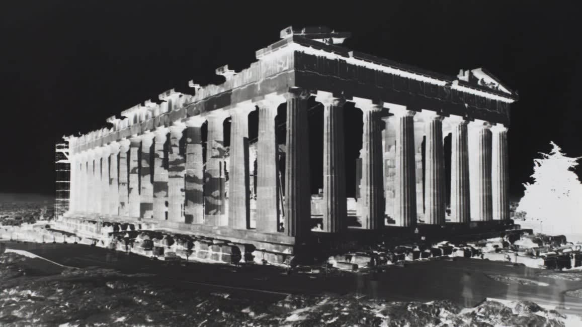 Black-and-white inverted image of the Acropolis building remains in Athens, Greece. 