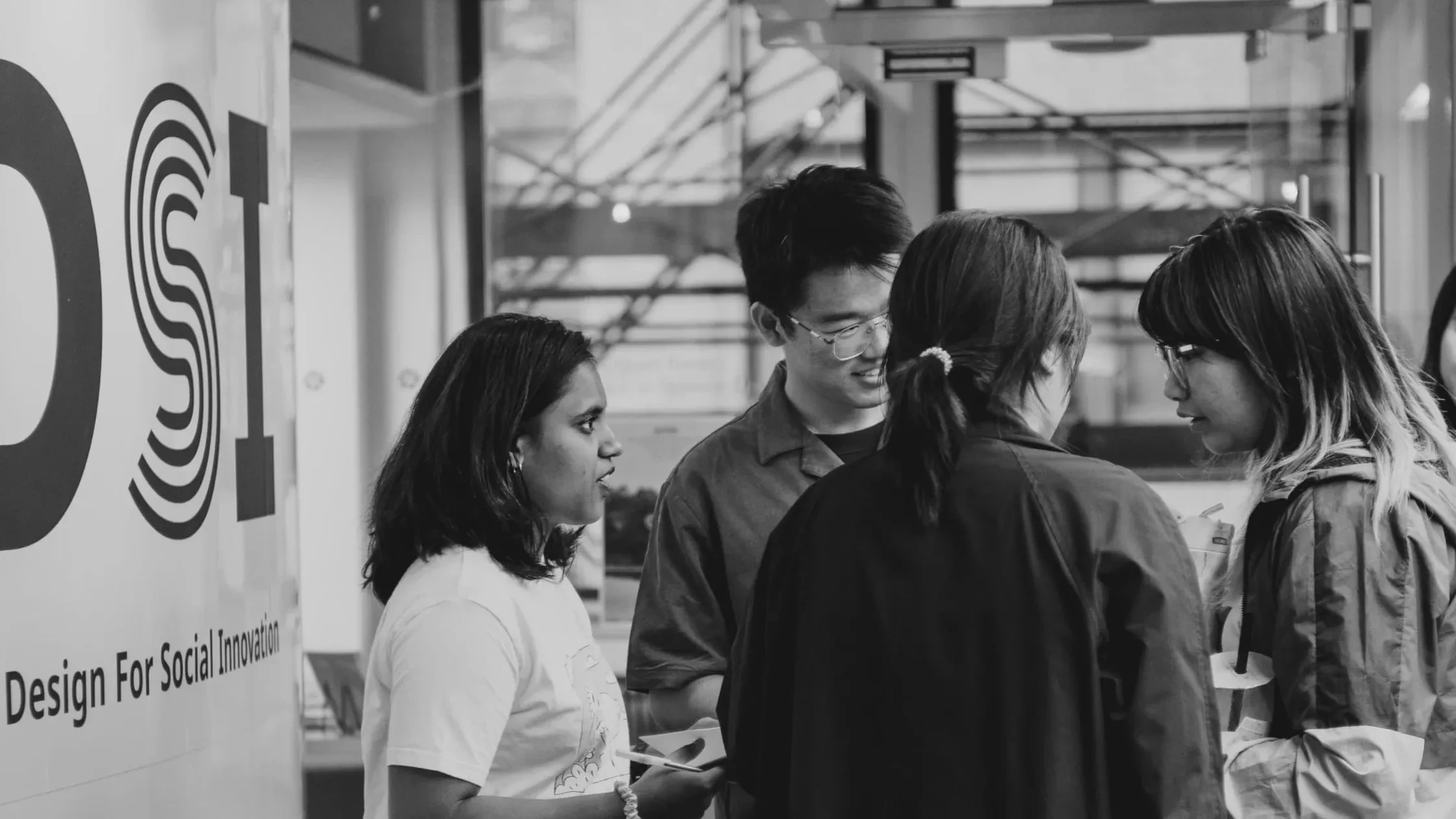 Black and white photo of students collaborating