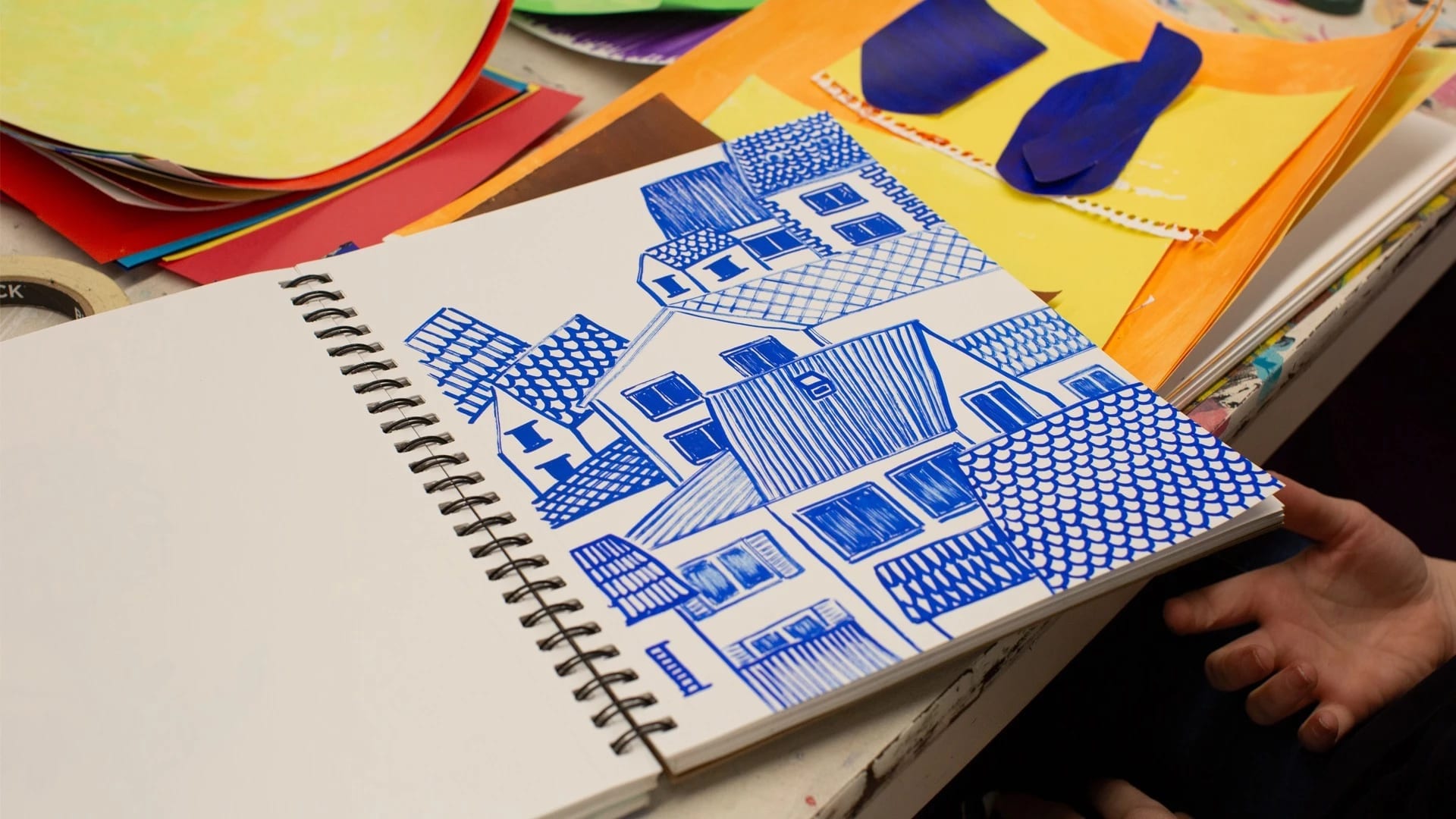 drawing of a cluster of houses in the color blue