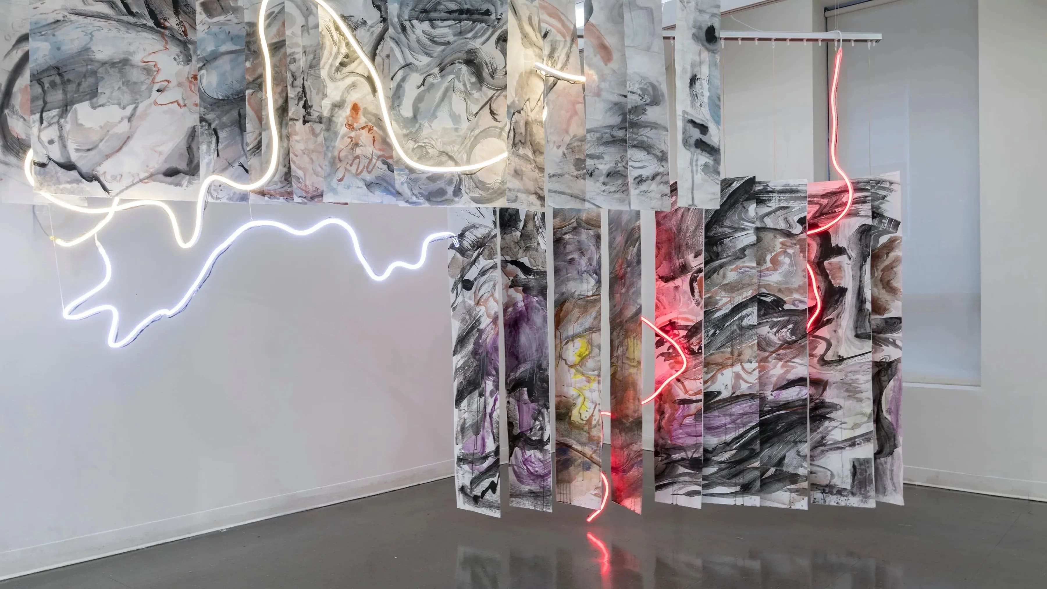 Painted panels with freeform neon stringed lights weaved throughout