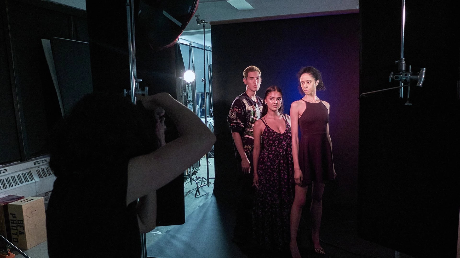 three models getting their photo taken in the studio