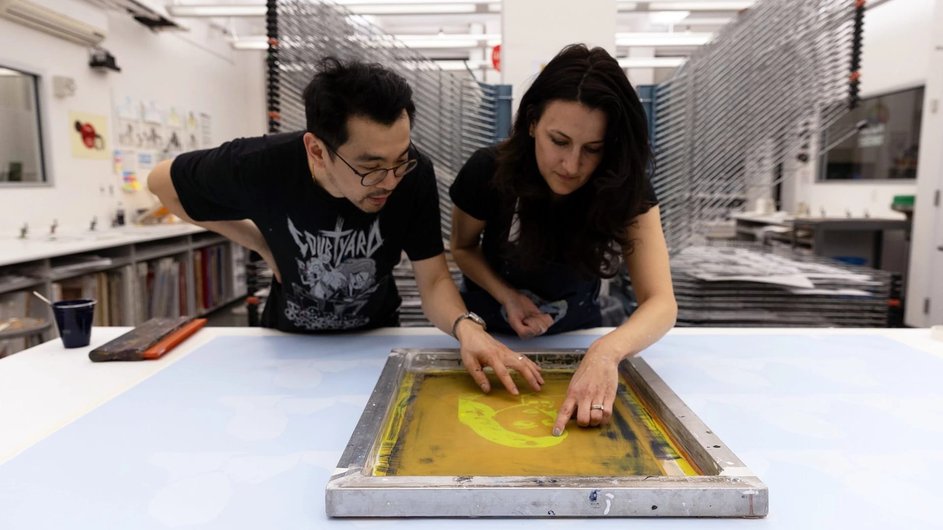 teacher assisting student