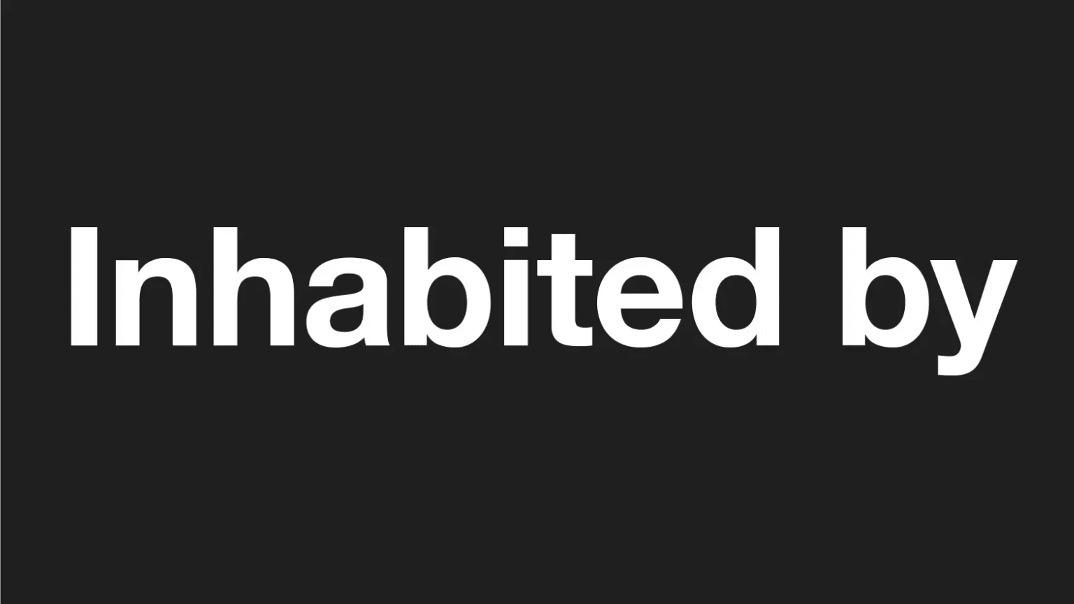 White bold text over black that reads "Inhabited By"