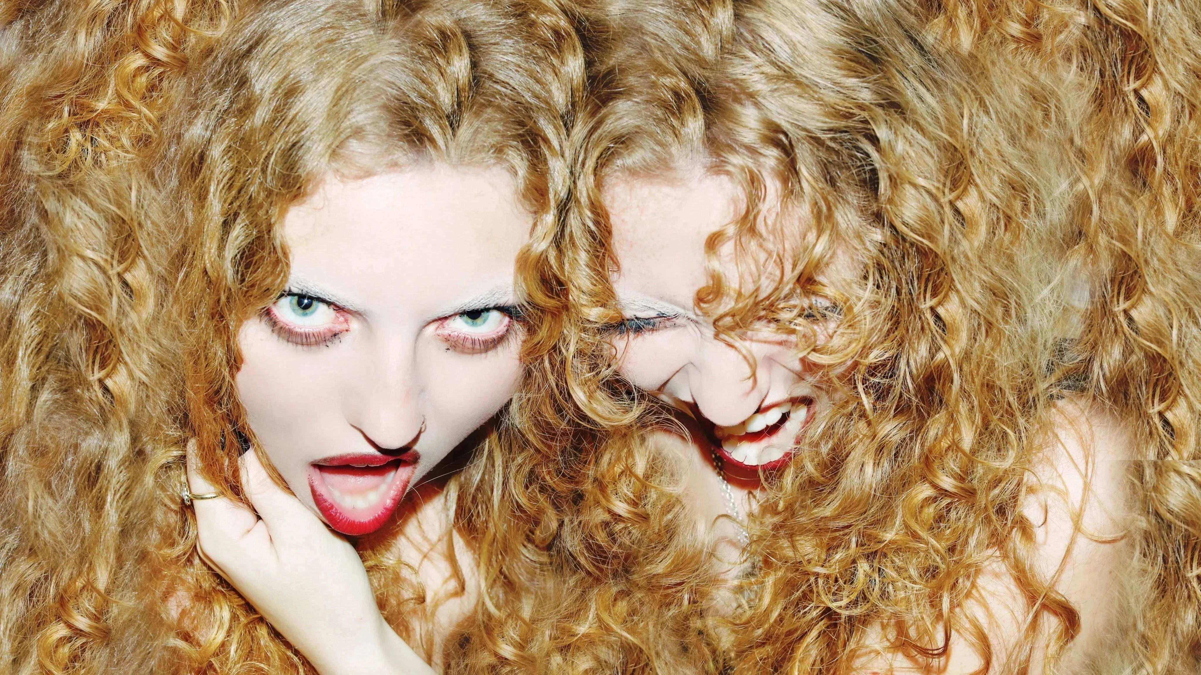 This is an image of my friends who are twins. They have beautiful curly hair and I wanted the image to blend the hair so that it looks like the hair belongs to both girls and that they are attached.