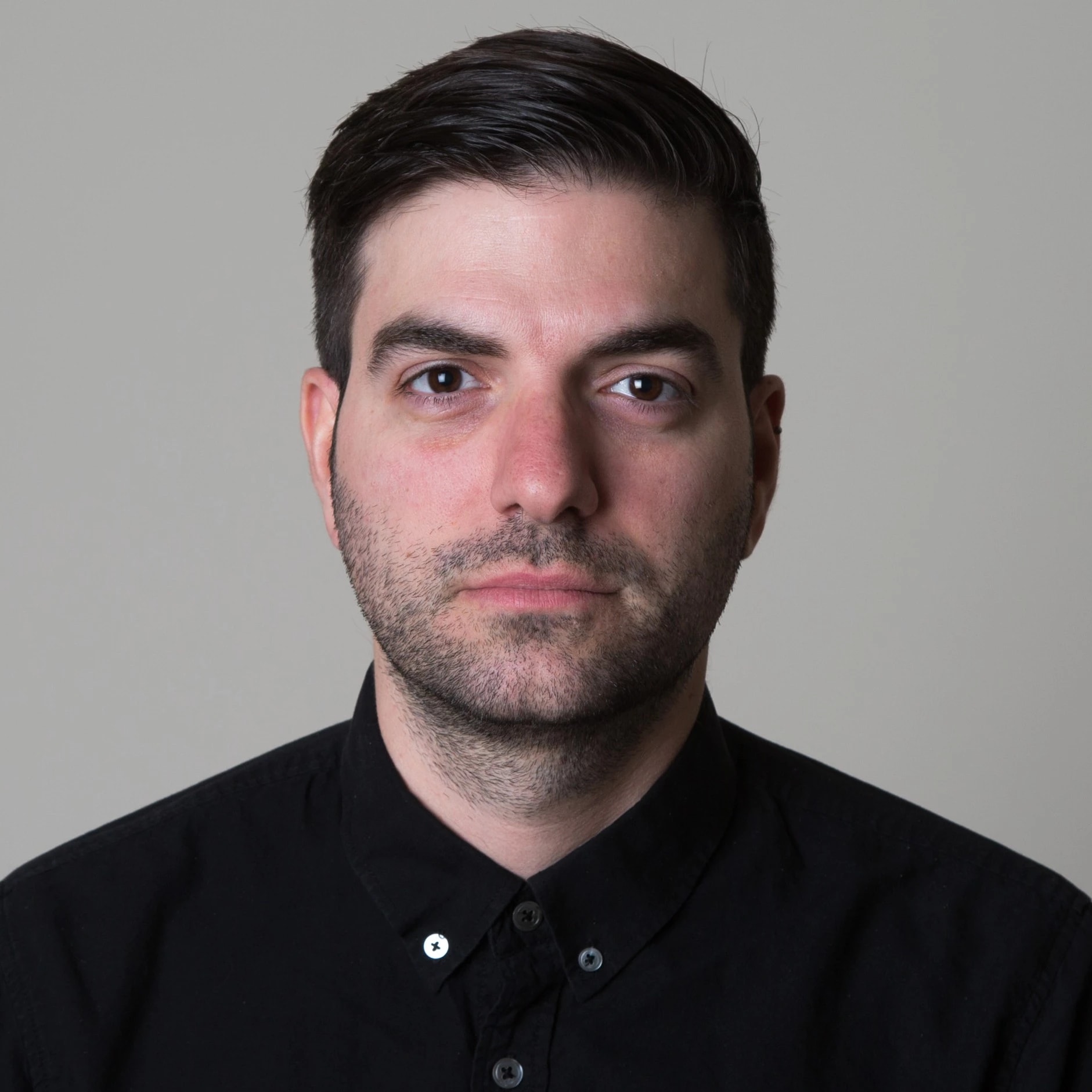 Portrait, male, grey background, black shirt