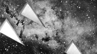 Wedges are overlaid on a photograph of a galaxy. The picture is grainy and grayscale.