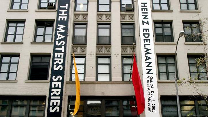 Skyscrapers with banners in front. One is for The Masters Series. The other is for Heinz Edelmann.