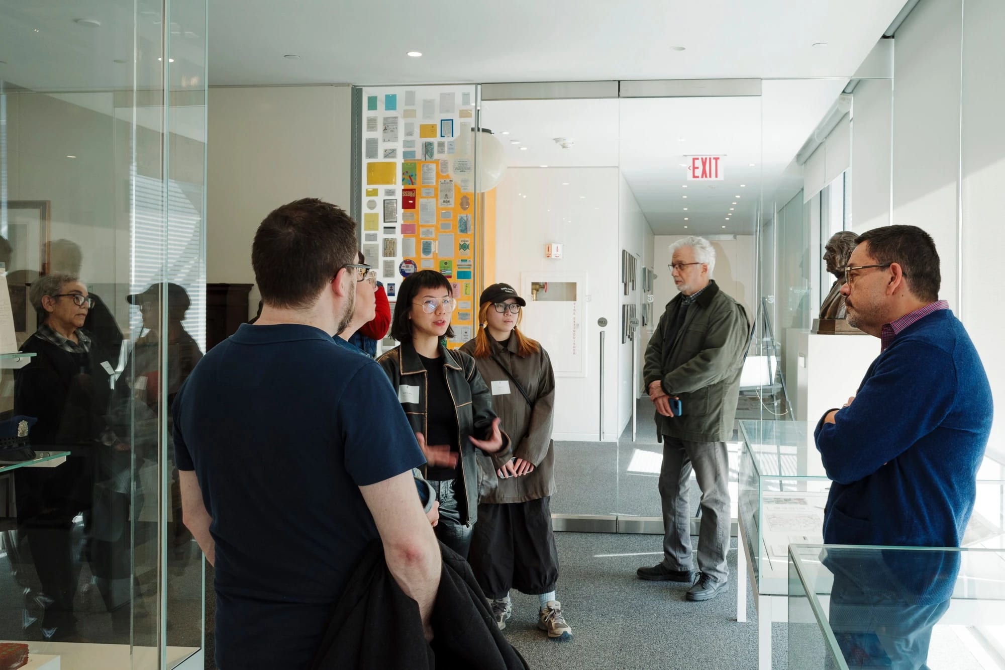 A photo from a class visit to the New York Times headquarter in New York City, where the Masters in Digital Photography students are inquiring about the history of the famed newsroom.