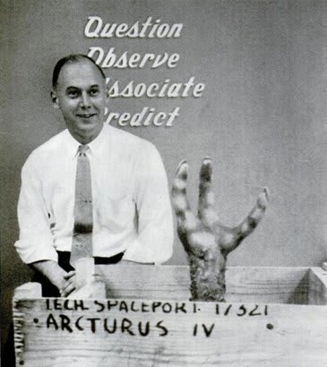 The alien hand reaches out of the box.