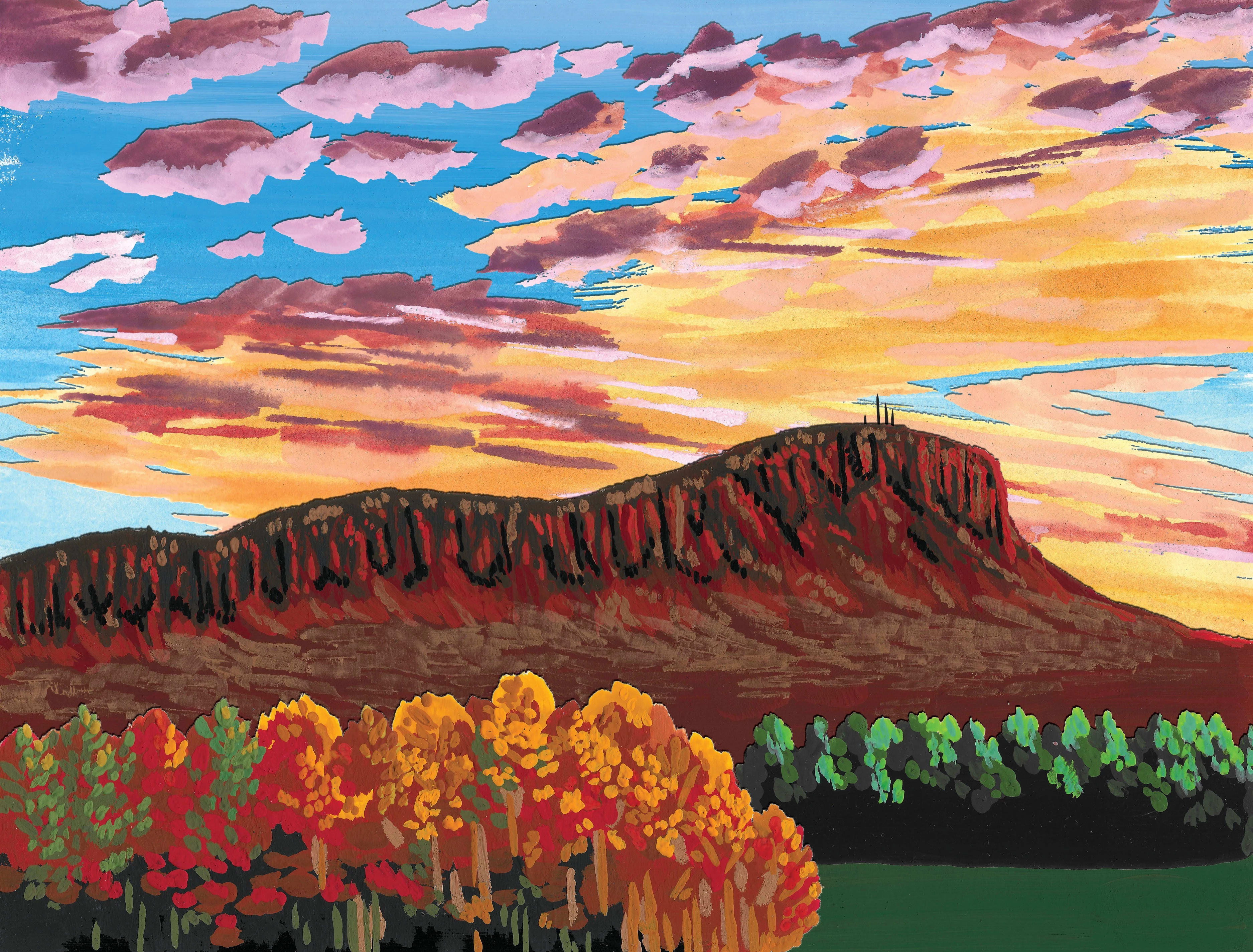 A plateau mountain rises above colorful autumn trees under a sky filled with vibrant sunset clouds.