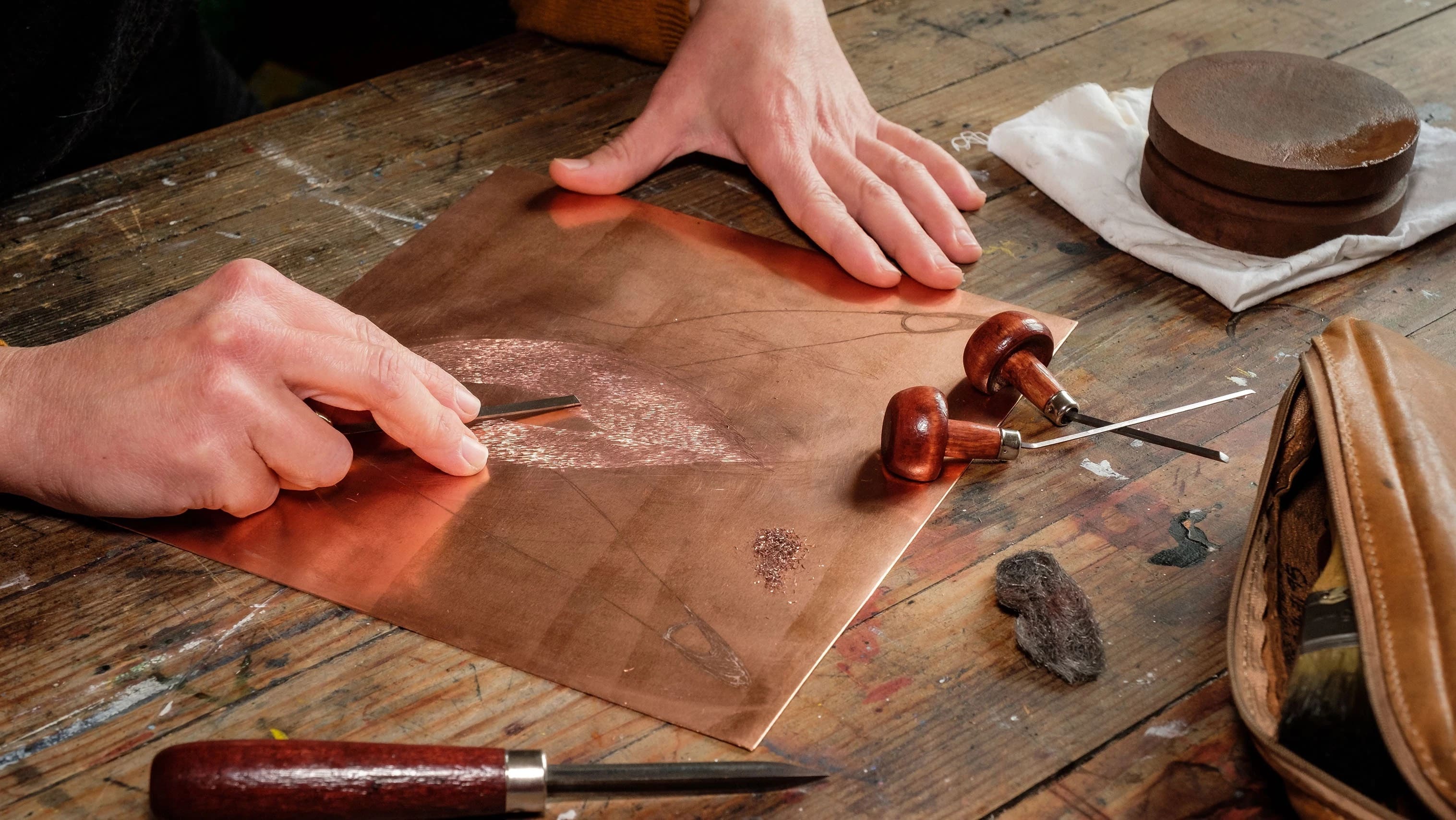 hands etching a copperplate